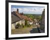 Gold Hill, cobbled lane lined with cottages and views over countryside, Shaftesbury, Dorset-Stuart Black-Framed Photographic Print