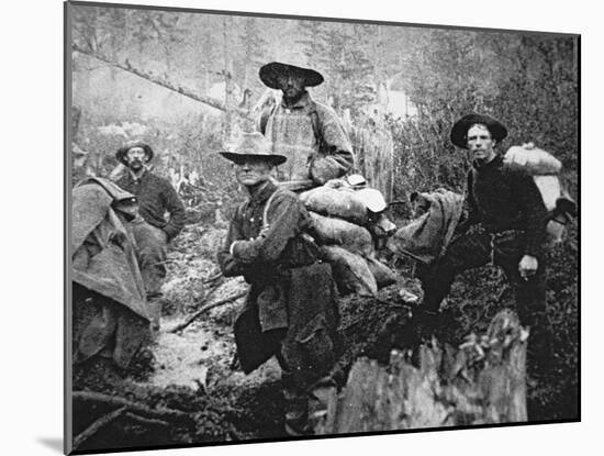 Gold Prospectors on the Move to Yukon Territory, Canada, During the Klondike Gold Rush-null-Mounted Giclee Print