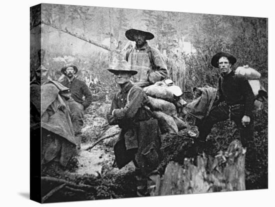 Gold Prospectors on the Move to Yukon Territory, Canada, During the Klondike Gold Rush-null-Stretched Canvas