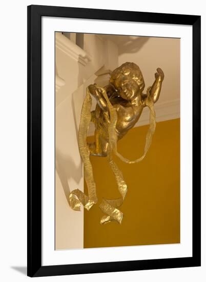 Gold Ribbon Trailing over Cherub Figure in Corner of Room-Richard Bryant-Framed Photo