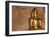 Golden Buddha Statue in Front of Burmese Writing on Wall, Bagan, Myanmar-Harry Marx-Framed Photographic Print