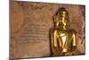 Golden Buddha Statue in Front of Burmese Writing on Wall, Bagan, Myanmar-Harry Marx-Mounted Photographic Print