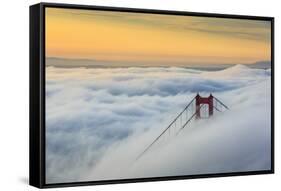 Golden Gate Bridge emerging from the morning fog at sunrise. San Francisco, Marin County, Californi-ClickAlps-Framed Stretched Canvas