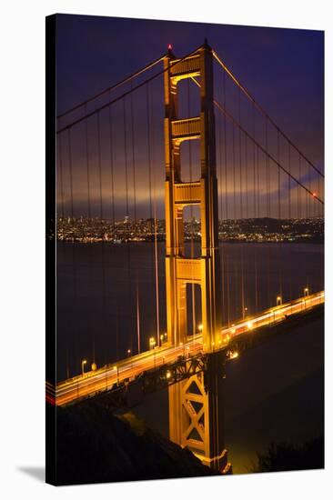 Golden Gate Bridge, Night Vertical with Lights of San Francisco, California in Background-William Perry-Stretched Canvas