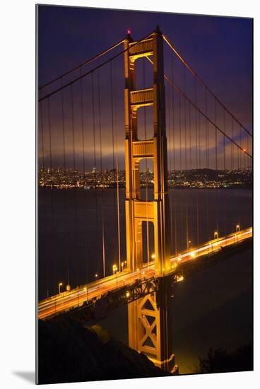 Golden Gate Bridge, Night Vertical with Lights of San Francisco, California in Background-William Perry-Mounted Photographic Print