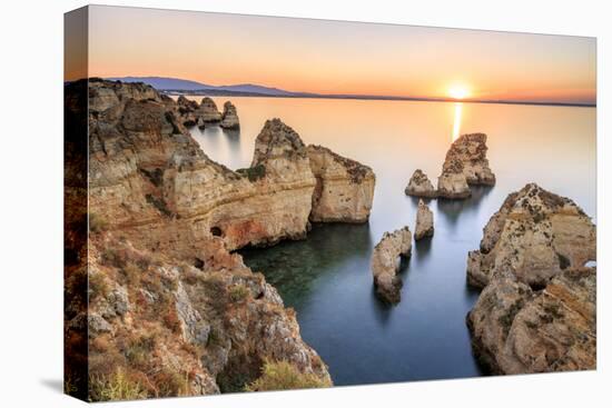 Golden sunrise on the  red cliffs of Ponta da Piedade Lagos Algarve Portugal Europe-ClickAlps-Stretched Canvas