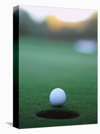 Golf Ball Close to Hole-Robert Llewellyn-Stretched Canvas