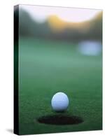 Golf Ball Close to Hole-Robert Llewellyn-Stretched Canvas