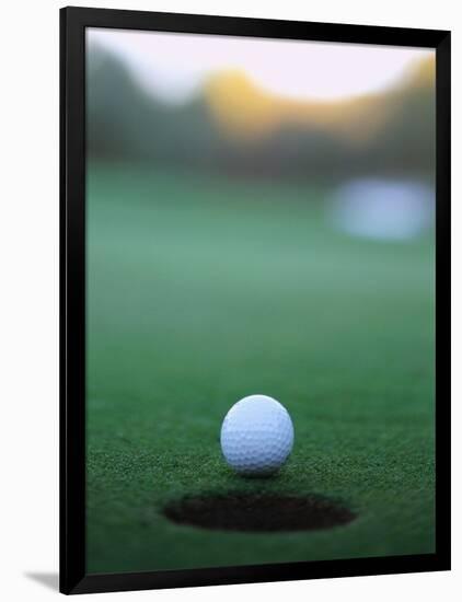 Golf Ball Close to Hole-Robert Llewellyn-Framed Photographic Print