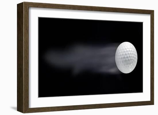 Golf Ball Leaving Trails Behind On Black Background-null-Framed Art Print