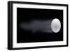 Golf Ball Leaving Trails Behind On Black Background-null-Framed Art Print