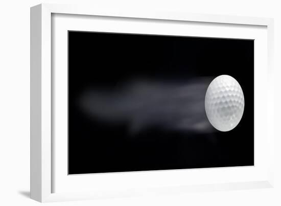 Golf Ball Leaving Trails Behind On Black Background-null-Framed Art Print