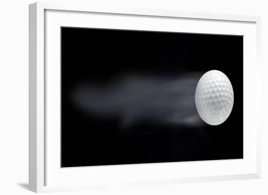 Golf Ball Leaving Trails Behind On Black Background-null-Framed Art Print