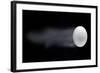 Golf Ball Leaving Trails Behind On Black Background-null-Framed Art Print