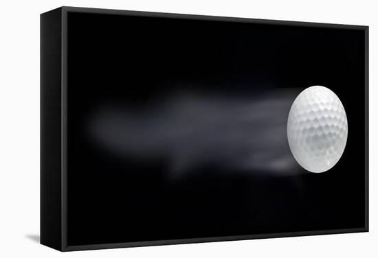 Golf Ball Leaving Trails Behind On Black Background-null-Framed Stretched Canvas