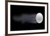 Golf Ball Leaving Trails Behind On Black Background-null-Framed Art Print