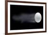 Golf Ball Leaving Trails Behind On Black Background-null-Framed Art Print