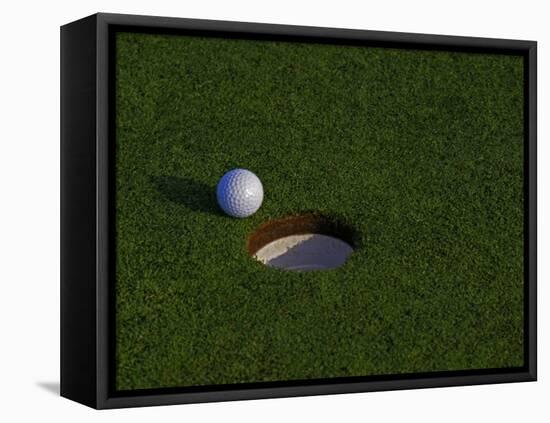 Golf Ball Sitting Near the Hole-null-Framed Stretched Canvas