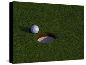 Golf Ball Sitting Near the Hole-null-Stretched Canvas