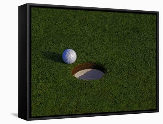 Golf Ball Sitting Near the Hole-null-Framed Stretched Canvas