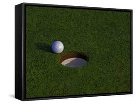 Golf Ball Sitting Near the Hole-null-Framed Stretched Canvas