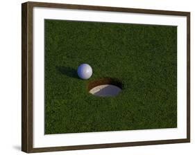 Golf Ball Sitting Near the Hole-null-Framed Photographic Print