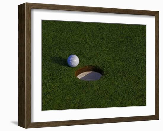 Golf Ball Sitting Near the Hole-null-Framed Photographic Print