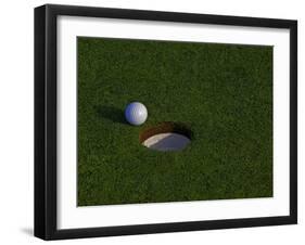 Golf Ball Sitting Near the Hole-null-Framed Photographic Print