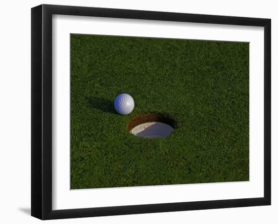 Golf Ball Sitting Near the Hole-null-Framed Photographic Print