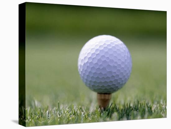 Golf Ball Sitting Oin a Tee-null-Stretched Canvas