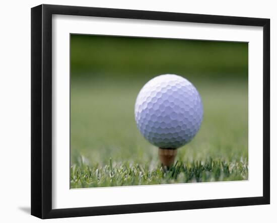 Golf Ball Sitting Oin a Tee-null-Framed Photographic Print