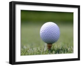 Golf Ball Sitting Oin a Tee-null-Framed Photographic Print