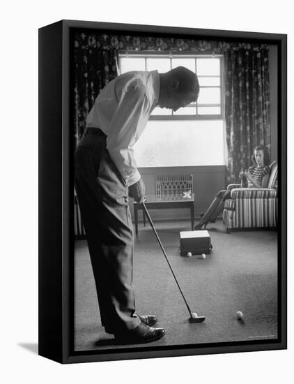 Golfer Ben Hogan Practicing Putting in His town house with Wife Valerie Watching from Armchair-Loomis Dean-Framed Stretched Canvas