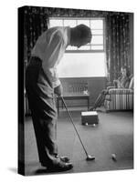 Golfer Ben Hogan Practicing Putting in His town house with Wife Valerie Watching from Armchair-Loomis Dean-Stretched Canvas