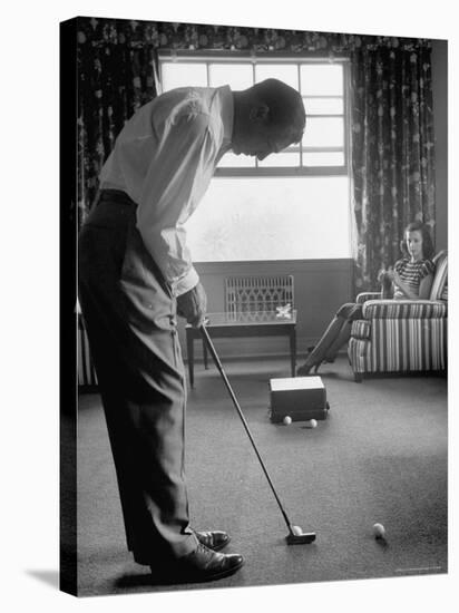 Golfer Ben Hogan Practicing Putting in His town house with Wife Valerie Watching from Armchair-Loomis Dean-Stretched Canvas