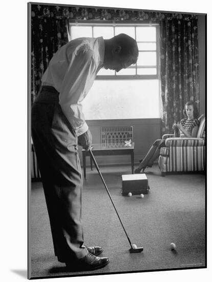 Golfer Ben Hogan Practicing Putting in His town house with Wife Valerie Watching from Armchair-Loomis Dean-Mounted Premium Photographic Print
