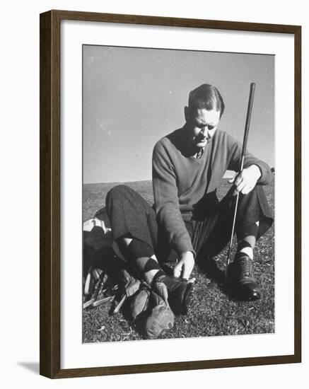 Golfer Byron Nelson Cleaning the Cleats on His Shoes-Gabriel Benzur-Framed Premium Photographic Print