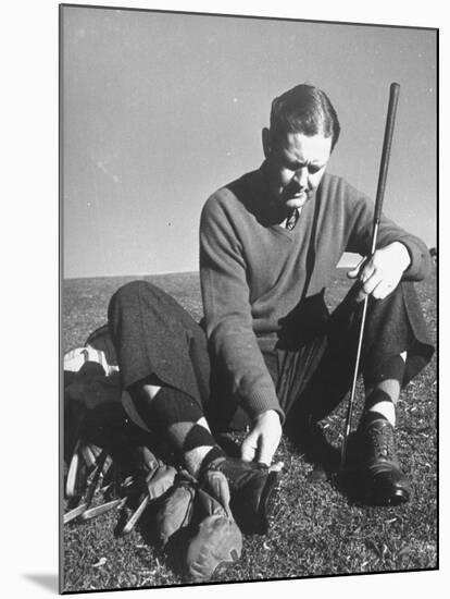 Golfer Byron Nelson Cleaning the Cleats on His Shoes-Gabriel Benzur-Mounted Premium Photographic Print