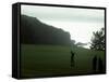 Golfer in Action with Water View Beyond-null-Framed Stretched Canvas