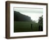 Golfer in Action with Water View Beyond-null-Framed Photographic Print