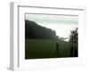 Golfer in Action with Water View Beyond-null-Framed Photographic Print