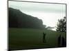 Golfer in Action with Water View Beyond-null-Mounted Photographic Print