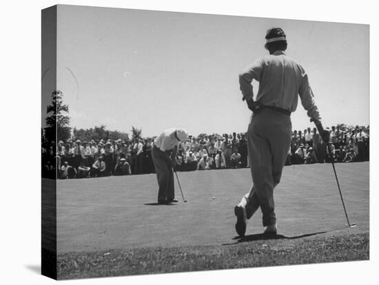 Golfer Putting the 12th Green-null-Stretched Canvas