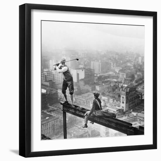 Golfer Teeing off on Girder High above City-null-Framed Premium Photographic Print