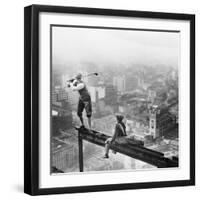Golfer Teeing off on Girder High above City-null-Framed Premium Photographic Print