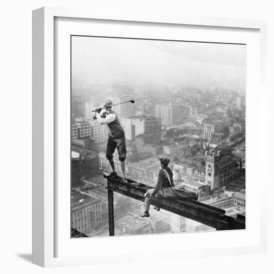 Golfer Teeing off on Girder High above City-null-Framed Premium Photographic Print