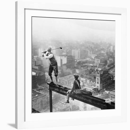 Golfer Teeing off on Girder High above City-null-Framed Photographic Print