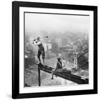 Golfer Teeing off on Girder High above City-null-Framed Photographic Print