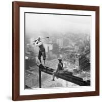 Golfer Teeing off on Girder High above City-null-Framed Photographic Print