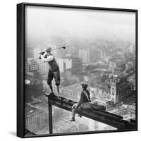 Golfer Teeing off on Girder High above City-null-Framed Photographic Print